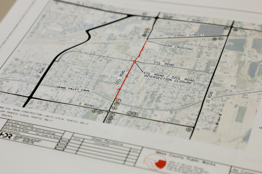 Photo of planning documents showing a map of 32 ½ road from E Road to Front Street. Various roads are highlighted on the map, and the document says Mesa County Public Works at the bottom of the page.